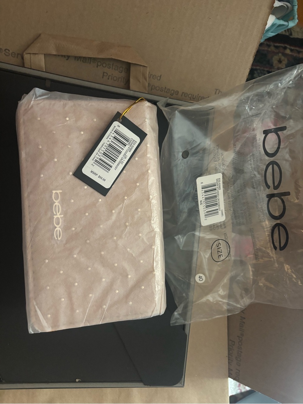 bebe Blush Pink Dot-Textured Wristlet Clutch with Gold Accent